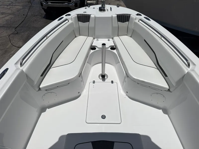 Slide: The Image of 2025 Wellcraft 242 Fisherman boat interior with white seating and sleek design. - 20