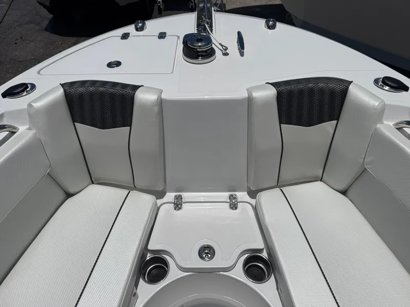 Slide: The Image of 2025 Wellcraft 242 Fisherman boat interior with cushioned seating and cup holders. - 22