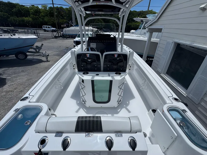 Slide: The Image of 2025 Wellcraft 242 Fisherman boat interior with seating and storage compartments. - 4