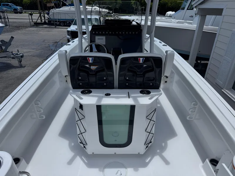 Slide: The Image of 2025 Wellcraft 242 Fisherman boat interior with seating and storage compartments. - 5