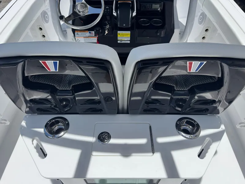 Slide: The Image of 2025 Wellcraft 242 Fisherman boat interior with dual seats and steering console. - 7