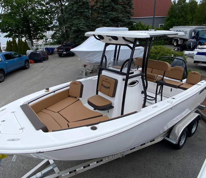 Slide: The Image of 2025 Sea Pro 225 Sandbar boat on trailer, featuring sleek design and spacious seating. - 3