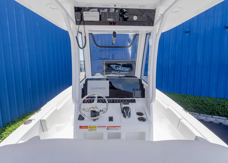 Slide: The Image of 2026 Sea Hunt Ultra 235 SE boat dashboard with Garmin navigation system. - 10