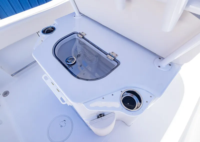 Slide: The Image of 2026 Sea Hunt Ultra 235 SE boat interior with livewell and cup holders. - 15