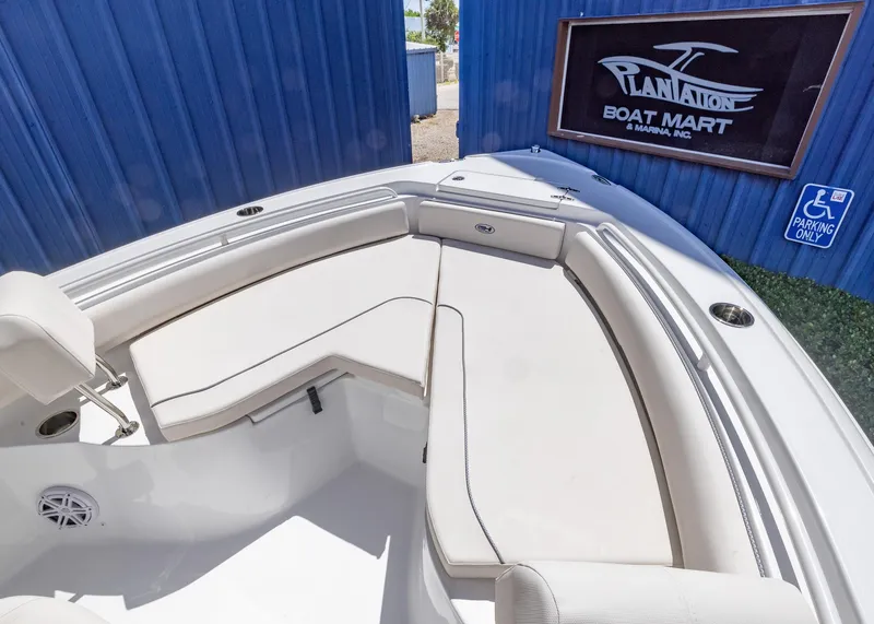 Slide: The Image of 2026 Sea Hunt Ultra 235 SE boat interior with seating, at Plantation Boat Mart. - 2