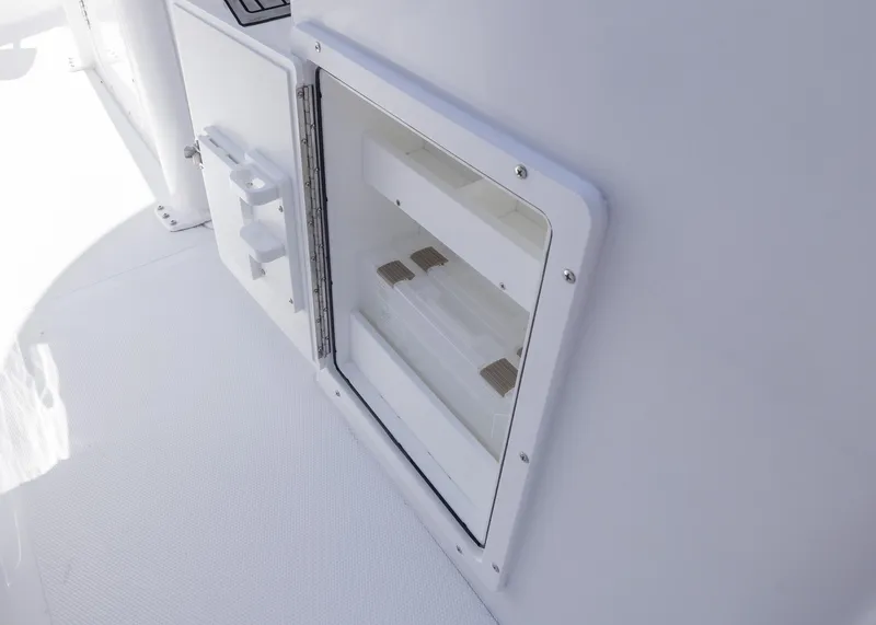 Slide: The Image of Storage compartment on 2026 Sea Hunt Ultra 235 SE boat, featuring a sleek white design. - 22