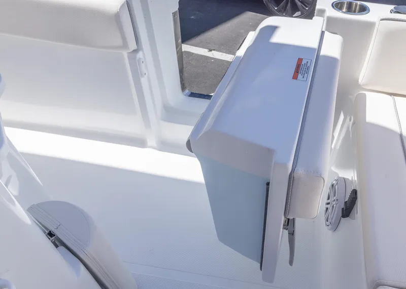 Slide: The Image of 2026 Sea Hunt Ultra 235 SE boat interior with foldable seat and storage. - 23
