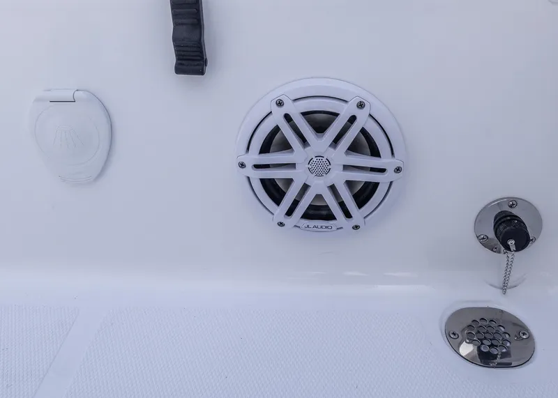 Slide: The Image of 2026 Sea Hunt Ultra 235 SE boat speaker and control panel close-up. - 24