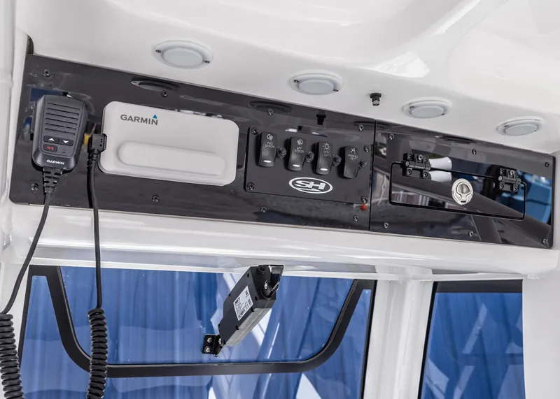 Slide: The Image of Control panel of 2026 Sea Hunt Ultra 235 SE boat with Garmin equipment. - 7