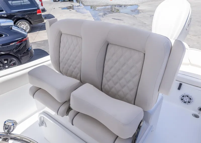 Slide: The Image of Luxurious seating on 2026 Sea Hunt Ultra 235 SE boat, featuring quilted upholstery. - 8