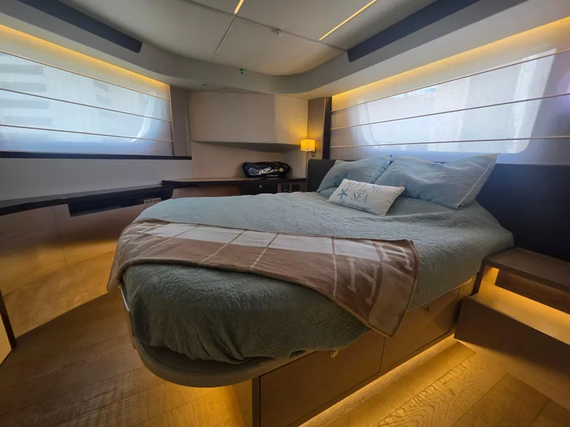 Slide: The Image of Luxurious bedroom interior of 2021 Absolute 47 Fly yacht with modern design and ambient lighting. - 15