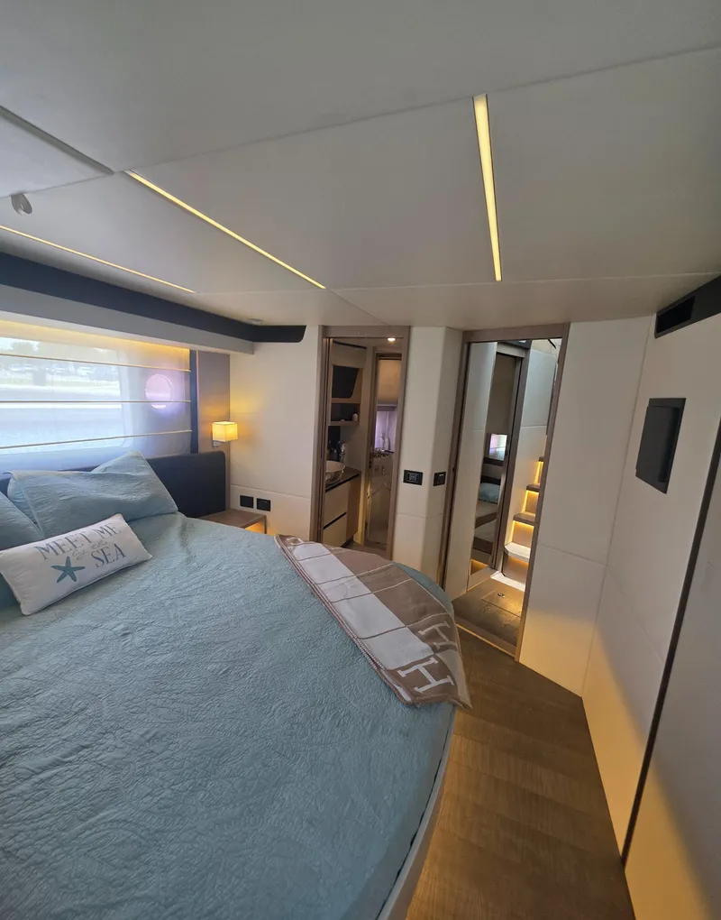 Slide: The Image of Luxurious bedroom interior of 2021 Absolute 47 Fly yacht with modern design and cozy bedding. - 18