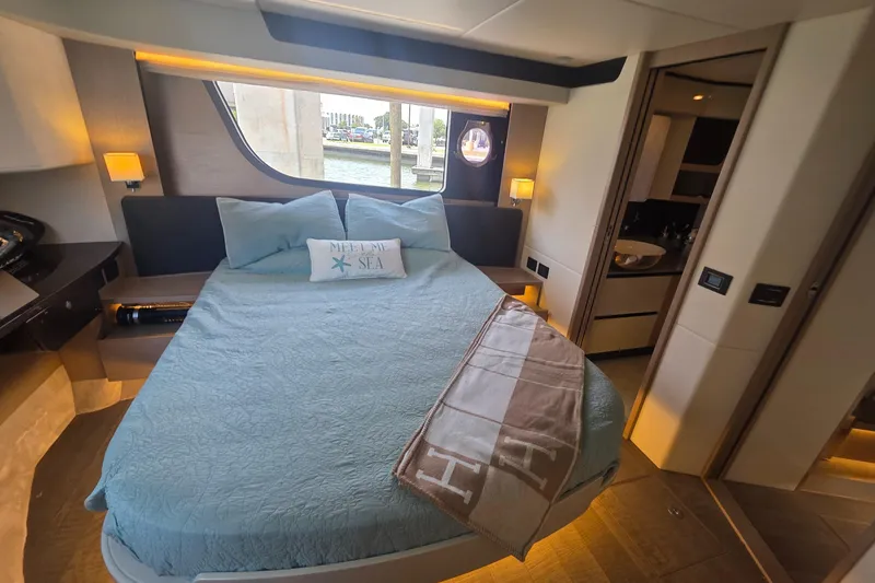 Slide: The Image of Luxurious bedroom interior of 2021 Absolute 47 Fly yacht with elegant decor and window view. - 19
