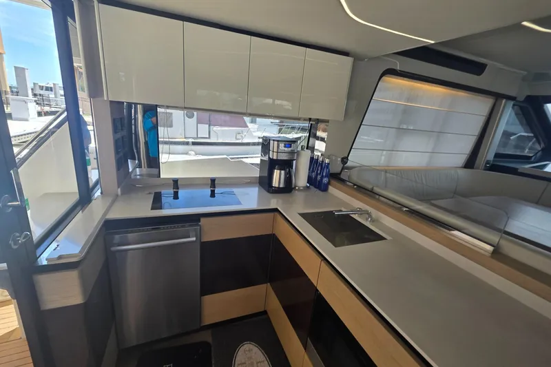 Slide: The Image of Modern kitchen interior of 2021 Absolute 47 Fly yacht, featuring sleek cabinetry and appliances. - 2