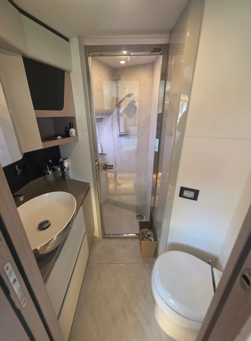 Slide: The Image of Modern bathroom on 2021 Absolute 47 Fly yacht with shower, sink, and toilet. - 20