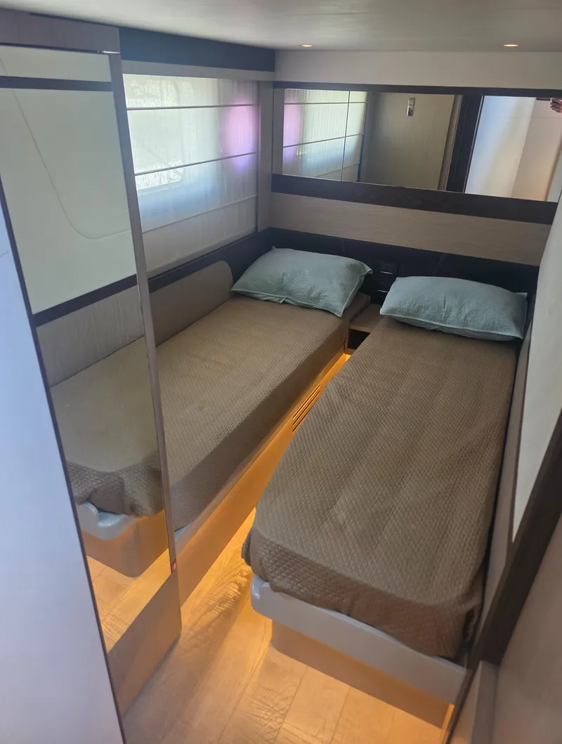 Slide: The Image of Twin cabin interior of 2021 Absolute 47 Fly yacht with modern design and ambient lighting. - 22