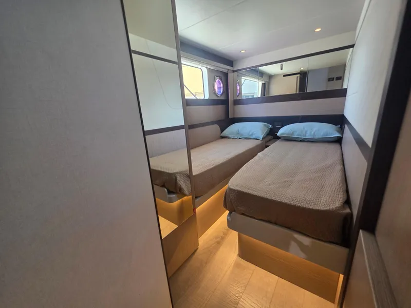 Slide: The Image of Luxurious twin bedroom in 2021 Absolute 47 Fly yacht, featuring modern design and ambient lighting. - 24