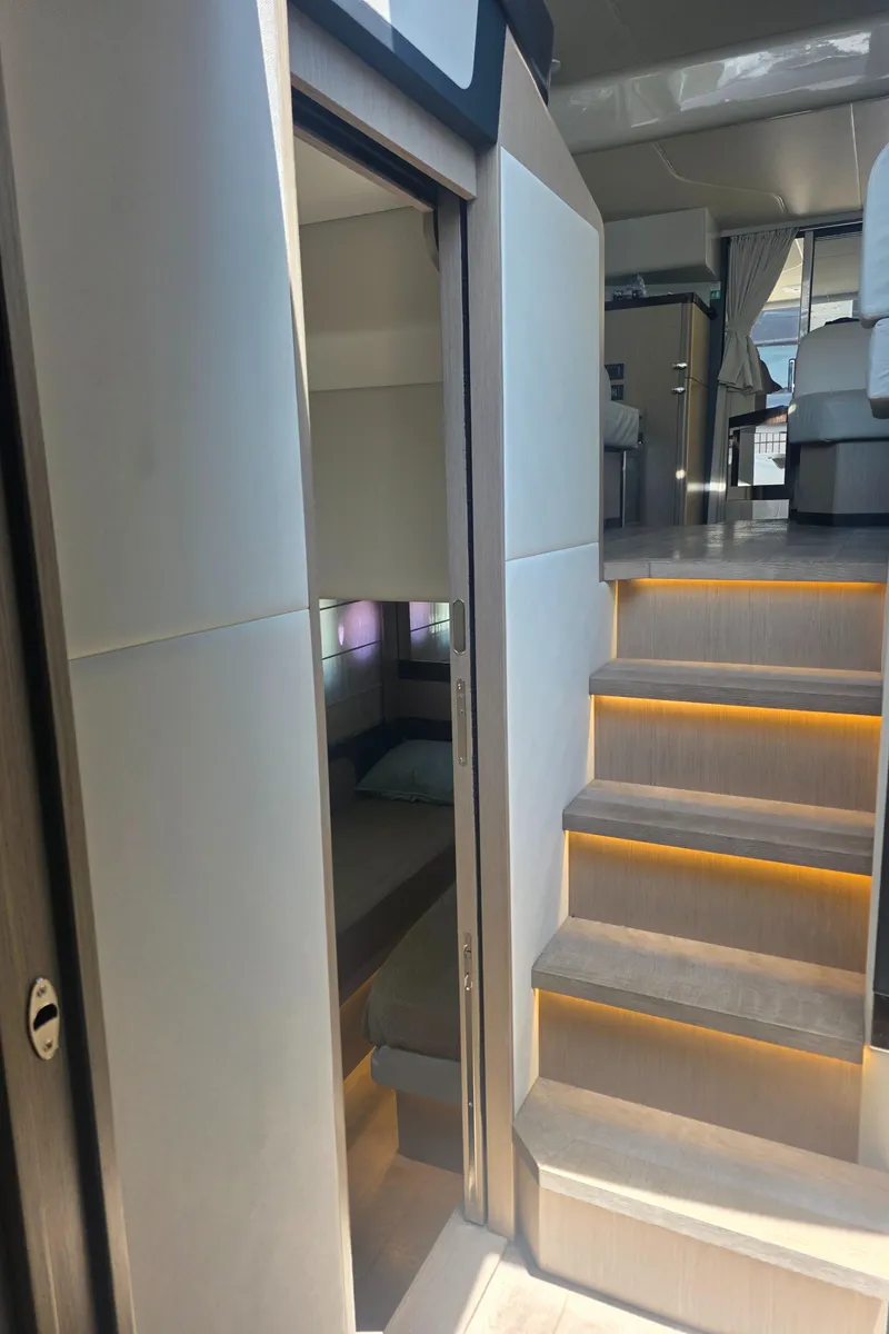 Slide: The Image of Interior of 2021 Absolute 47 Fly yacht with modern stairs and cozy cabin. - 26