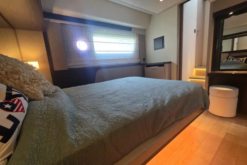 Slide: The Image of Luxurious bedroom interior of 2021 Absolute 47 Fly yacht with modern decor and ambient lighting. - 29