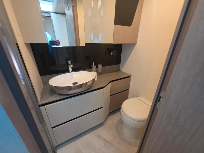 Slide: The Image of Modern bathroom in 2021 Absolute 47 Fly yacht with sleek sink and toilet. - 32