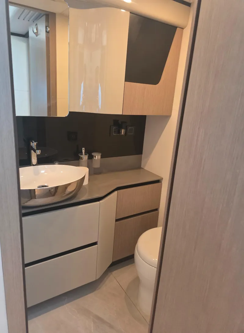 Slide: The Image of Modern bathroom interior on Absolute 47 Fly yacht, featuring sleek cabinetry and a stylish sink. - 33