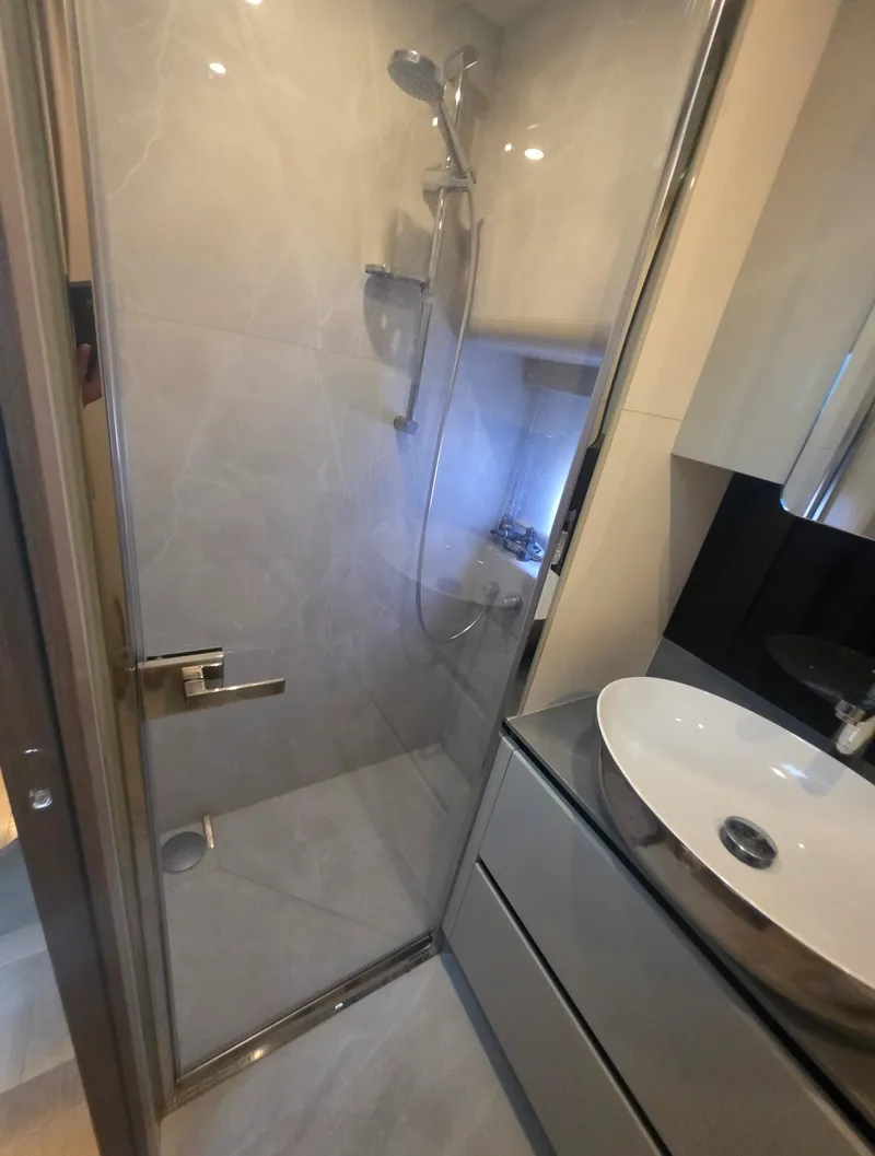 Slide: The Image of Modern bathroom with glass shower and sleek sink in 2021 Absolute 47 Fly yacht. - 34