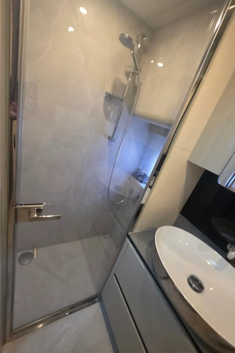 Slide: The Image of Modern bathroom with glass shower in 2021 Absolute 47 Fly yacht. - 35