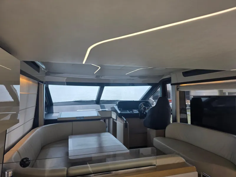 Slide: The Image of Luxurious interior of 2021 Absolute 47 Fly yacht with modern seating and helm station. - 39