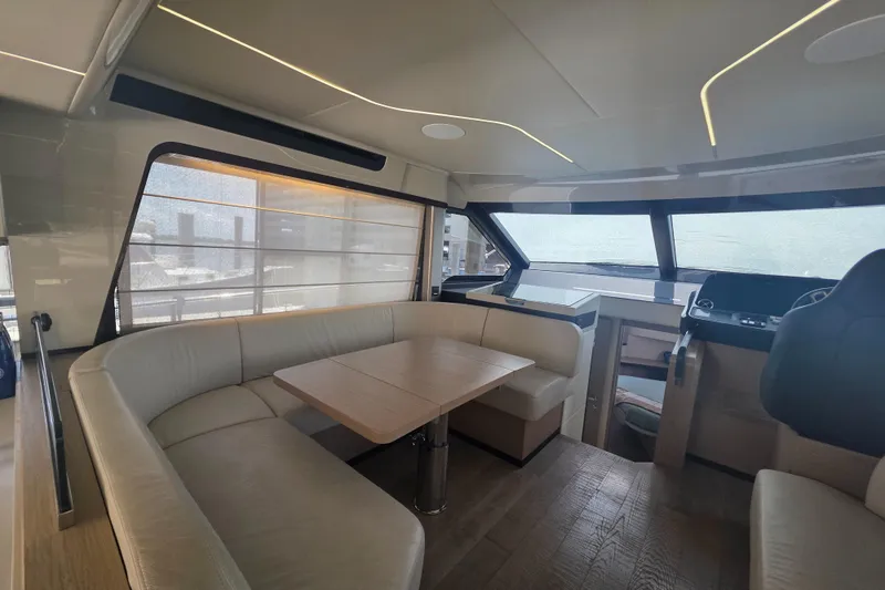 Slide: The Image of Luxurious interior of 2021 Absolute 47 Fly yacht with modern seating and dining area. - 41