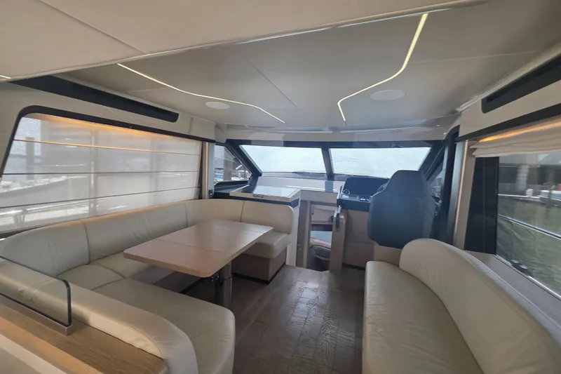 Slide: The Image of Luxurious interior of 2021 Absolute 47 Fly yacht with modern seating and helm. - 42