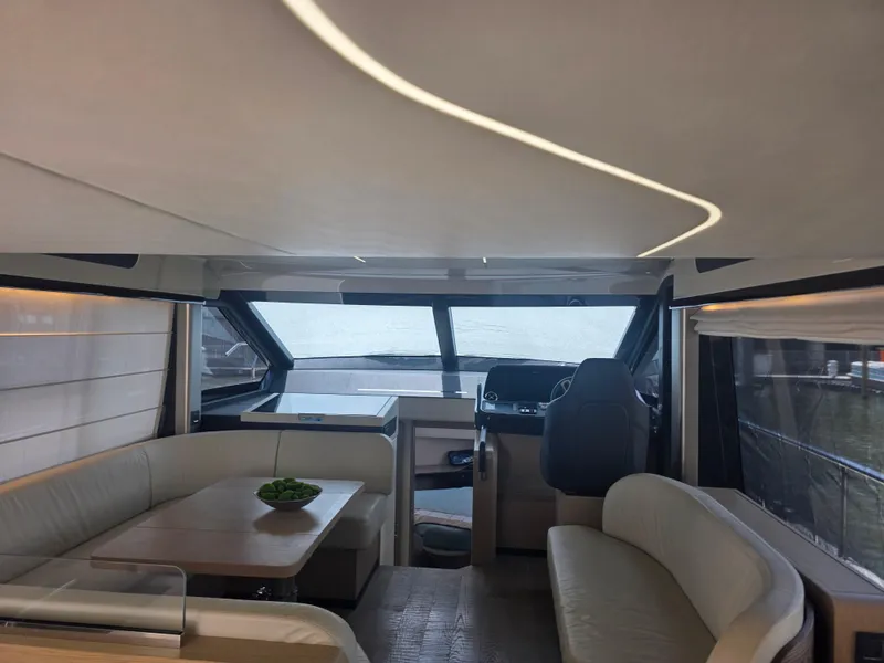 Slide: The Image of Interior of 2021 Absolute 47 Fly yacht with modern seating and helm station. - 44