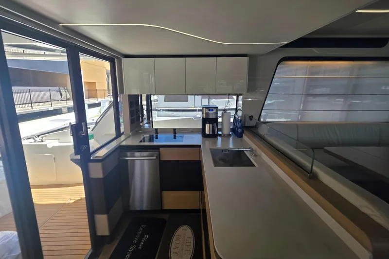 Slide: The Image of Modern kitchen interior on 2021 Absolute 47 Fly yacht, featuring sleek design and appliances. - 46