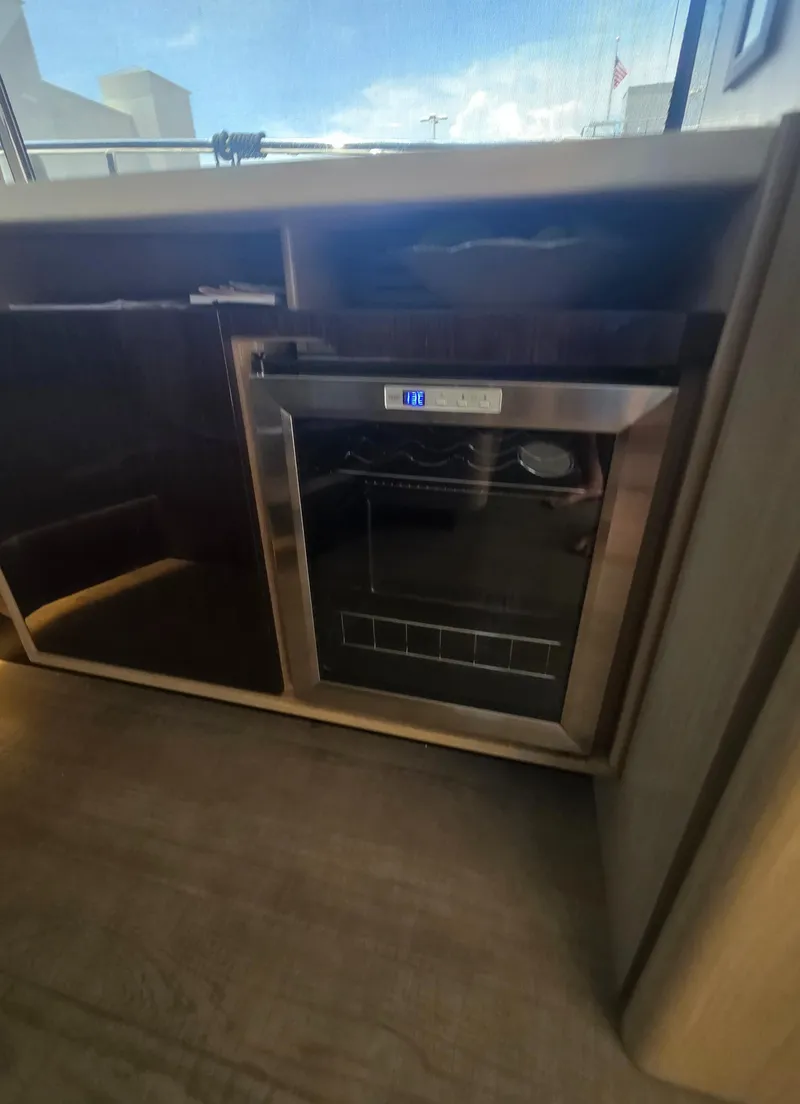 Slide: The Image of Modern kitchen area in 2021 Absolute 47 Fly yacht with built-in stainless steel appliance. - 48