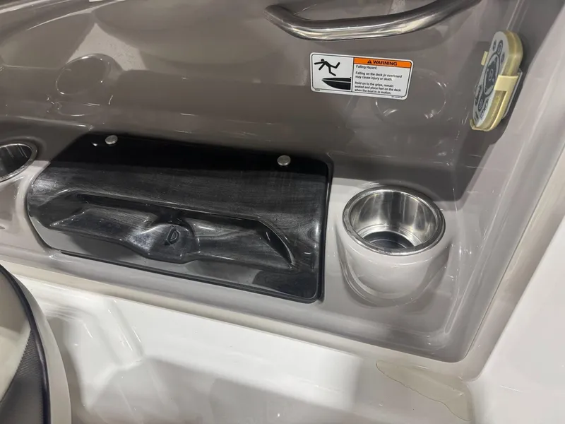 Slide: The Image of Interior of 2011 Yamaha 242 Limited boat with cup holder and warning label. - 13