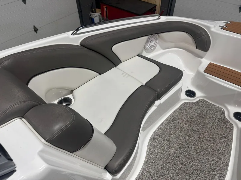 Slide: The Image of 2011 Yamaha Boats 242 Limited interior seating with gray and white upholstery. - 14