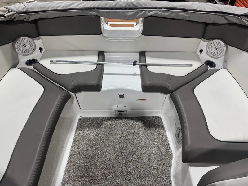 Slide: The Image of Interior seating of 2011 Yamaha Boats 242 Limited, featuring gray and white upholstery. - 6