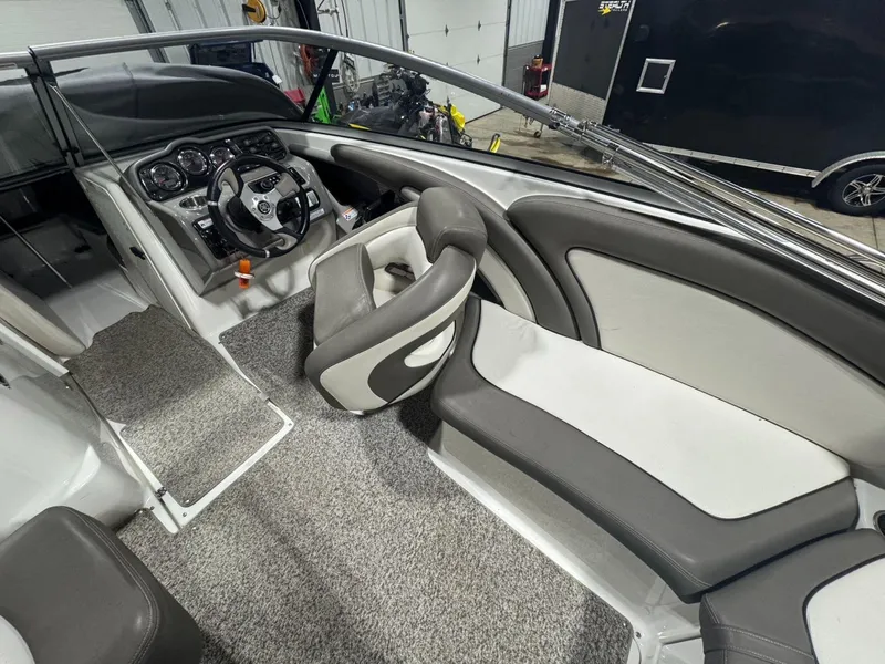 Slide: The Image of Interior of 2011 Yamaha Boats 242 Limited, featuring steering wheel and seating area. - 7