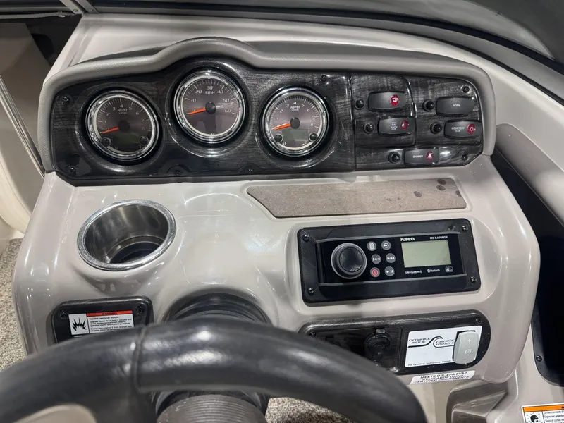 Slide: The Image of Dashboard of a 2011 Yamaha Boats 242 Limited, featuring gauges and controls. - 8
