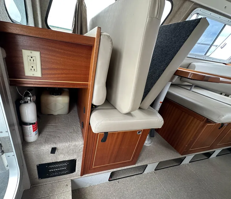Slide: The Image of Interior of 2016 KingFisher 3025 Destination boat with seating and storage compartments. - 18