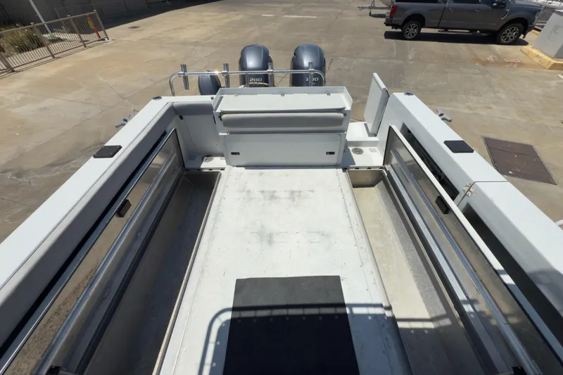 Slide: The Image of 2016 KingFisher 3025 Destination boat Deck with Fish Boxes Open. - 26