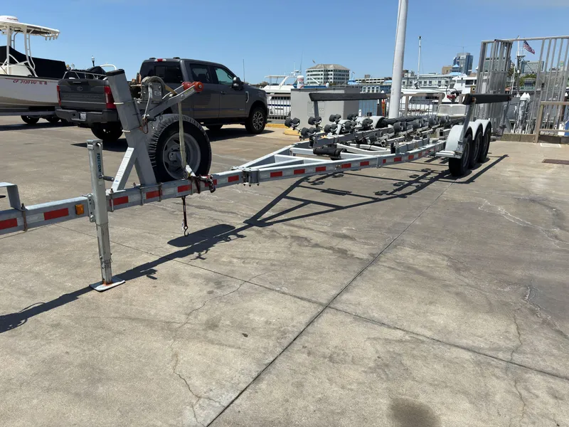 Slide: The Image of Boat trailer parked on concrete, near a KingFisher 3025 Destination, 2016 model. - 37