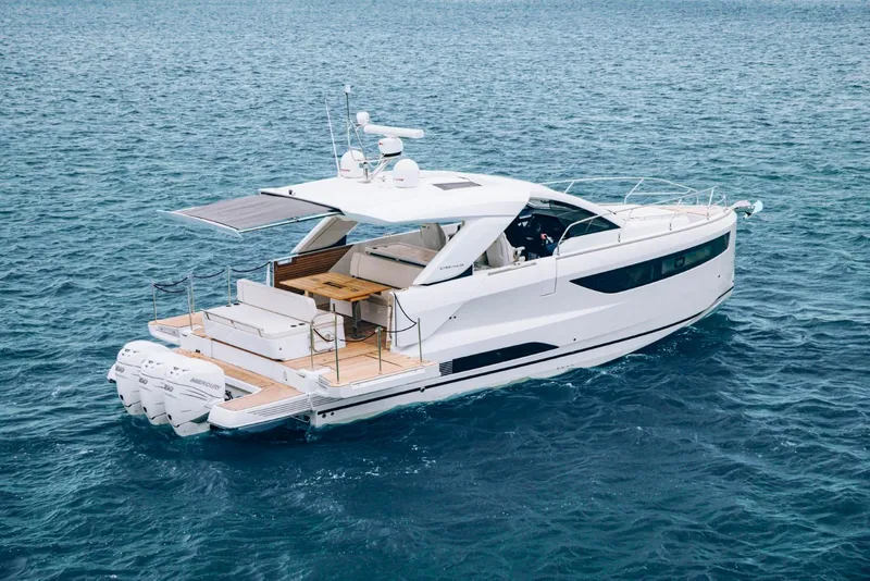 Slide: The Image of 2025 Jeanneau DB 43 yacht cruising on open water, showcasing sleek design and powerful engines. - 5