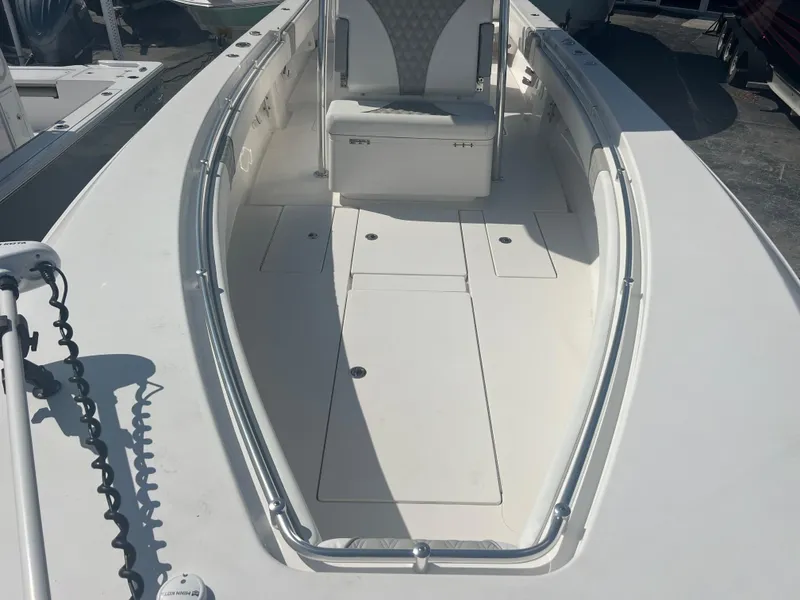 Slide: The Image of 2021 Contender 32 ST boat interior with seating and storage compartments. - 15