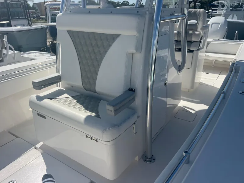 Slide: The Image of 2021 Contender 32 ST boat interior with cushioned seating and stainless steel features. - 18