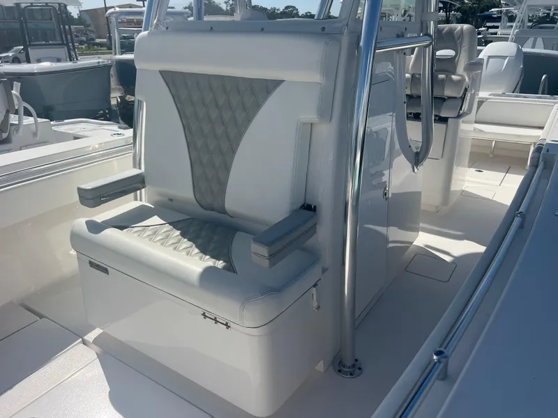 Slide: The Image of 2021 Contender 32 ST boat interior with cushioned seating and stainless steel accents. - 19