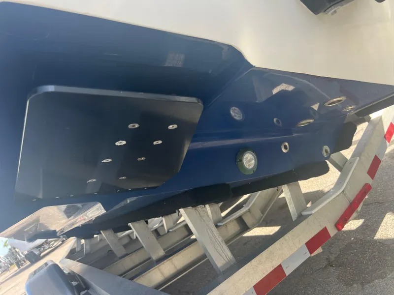 Slide: The Image of 2021 Contender 32 ST boat on trailer, showing hull and fittings. - 27