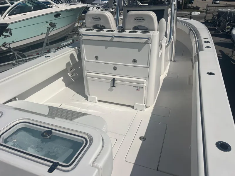 Slide: The Image of 2021 Contender 32 ST boat interior with seating and storage compartments. - 8