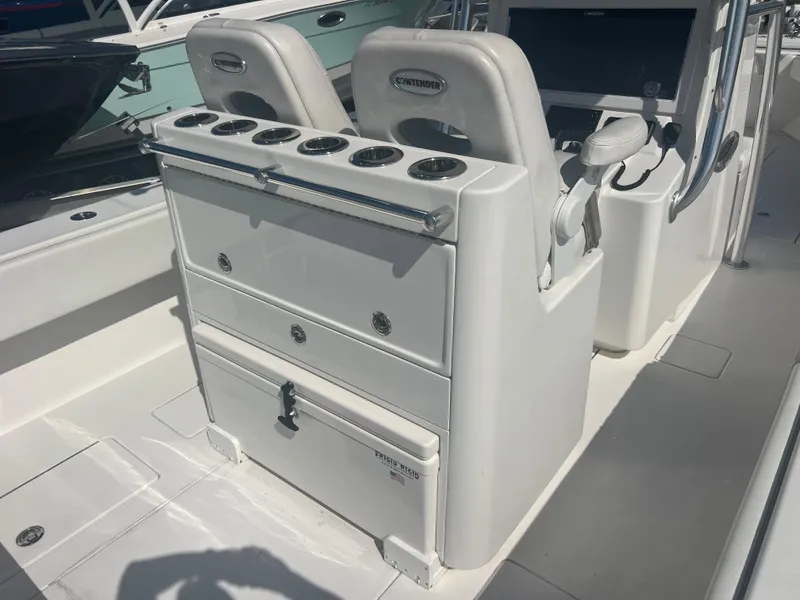 Slide: The Image of 2021 Contender 32 ST boat interior with helm station and seating. - 9