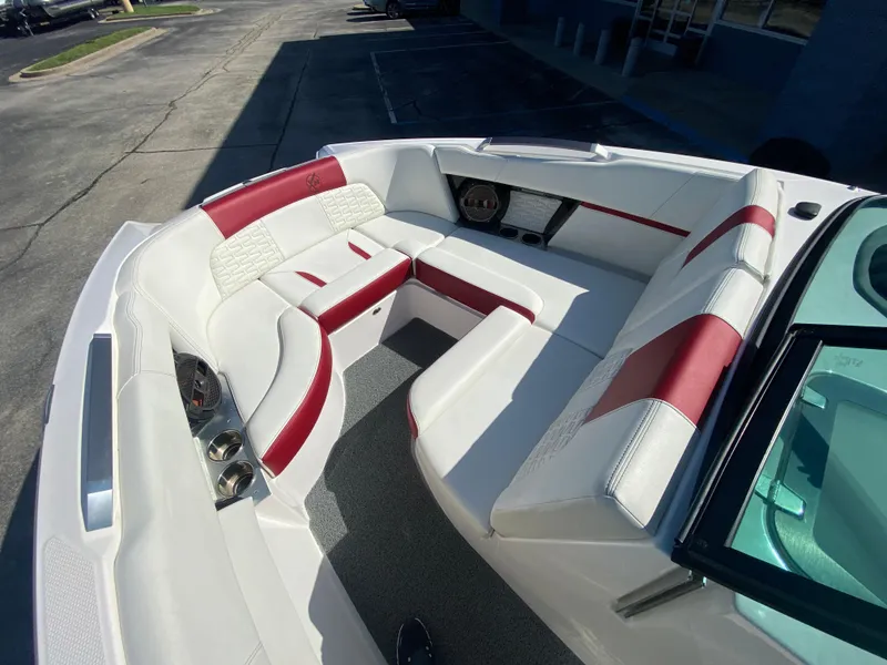 Slide: The Image of Luxurious 2020 MasterCraft X26 boat interior with red and white seating. - 33
