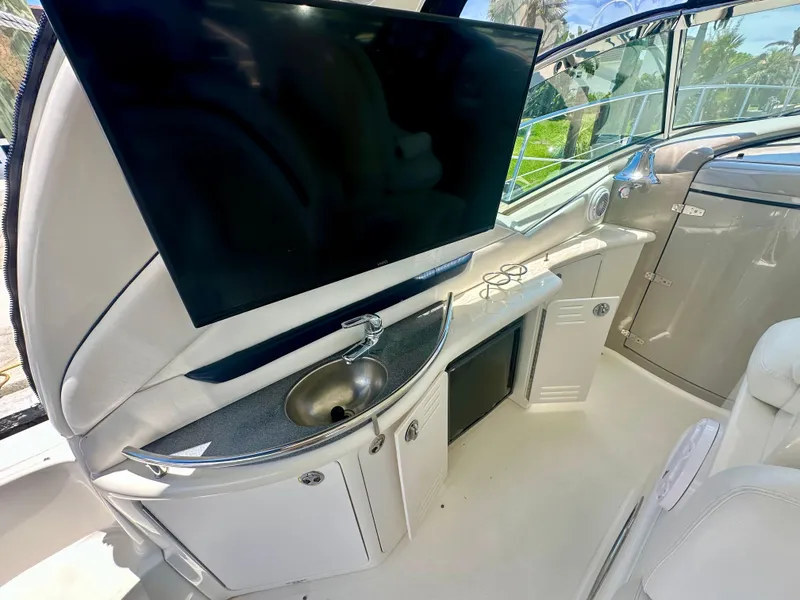 Slide: The Image of Luxurious interior of 2005 Sea Ray 420 Sundancer with TV and sink. - 10